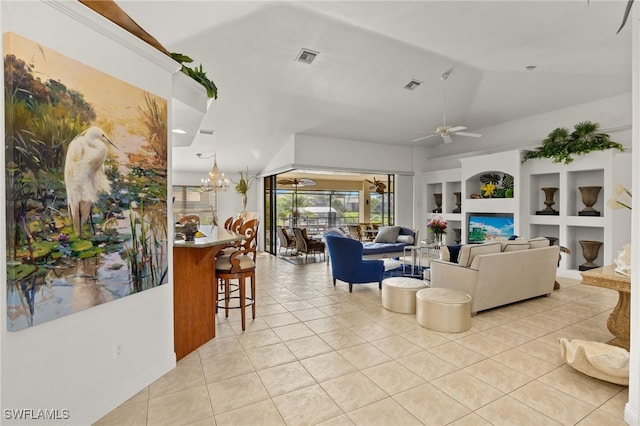 living room with light tile patterned floors, visible vents, built in features, lofted ceiling, and ceiling fan with notable chandelier