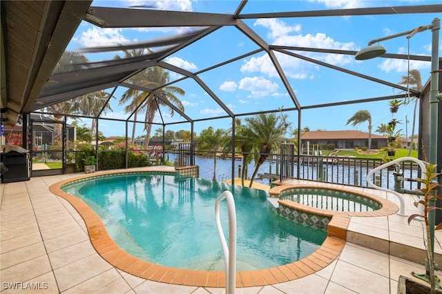 view of swimming pool featuring a water view, glass enclosure, a pool with connected hot tub, and a patio