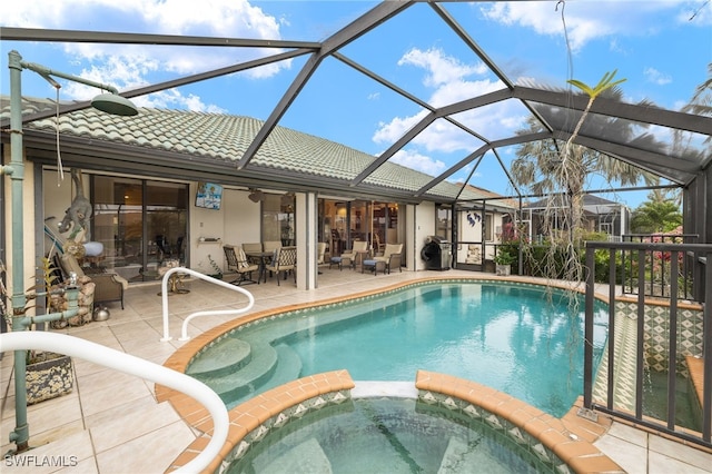 view of swimming pool with a patio and a pool with connected hot tub