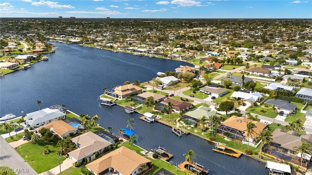 aerial view featuring a water view and a residential view