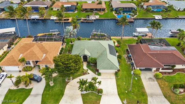 bird's eye view featuring a residential view and a water view