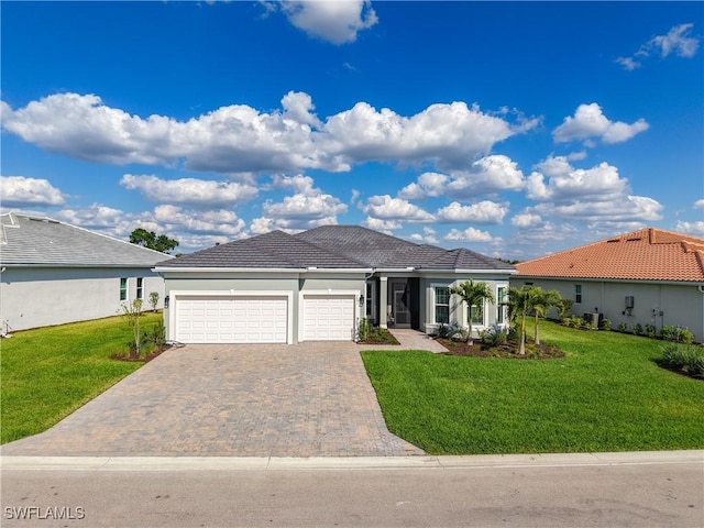 7041 Del Webb Oak Creek Blvd, North Fort Myers, FL 33917 - single story home featuring a tile roof, an attached garage, decorative driveway, a front yard, and stucco siding