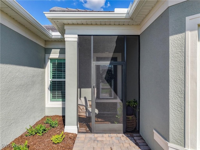 7041 Del Webb Oak Creek Blvd, North Fort Myers, FL 33917 - view of exterior entry featuring stucco siding