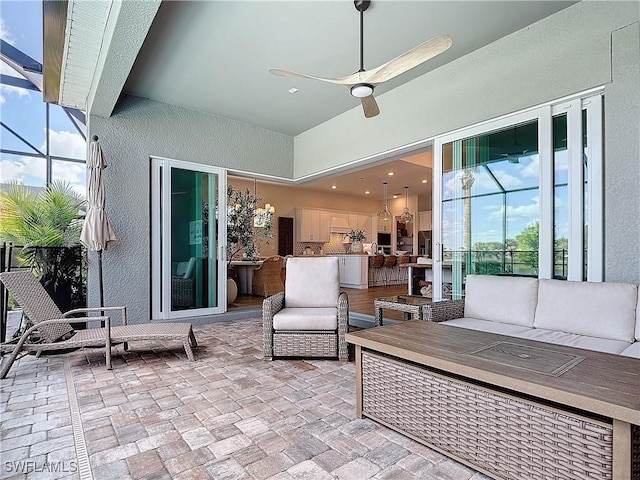 7041 Del Webb Oak Creek Blvd, North Fort Myers, FL 33917 - view of patio / terrace featuring a ceiling fan, a lanai, and outdoor lounge area