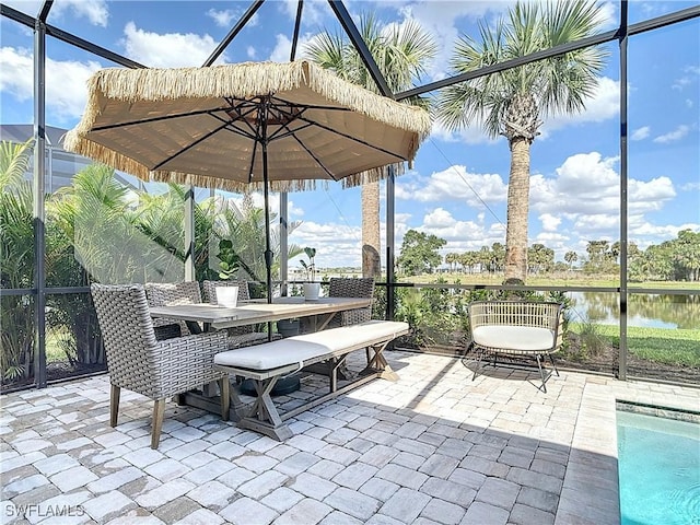 7041 Del Webb Oak Creek Blvd, North Fort Myers, FL 33917 - view of patio with a lanai, a water view, and outdoor dining area