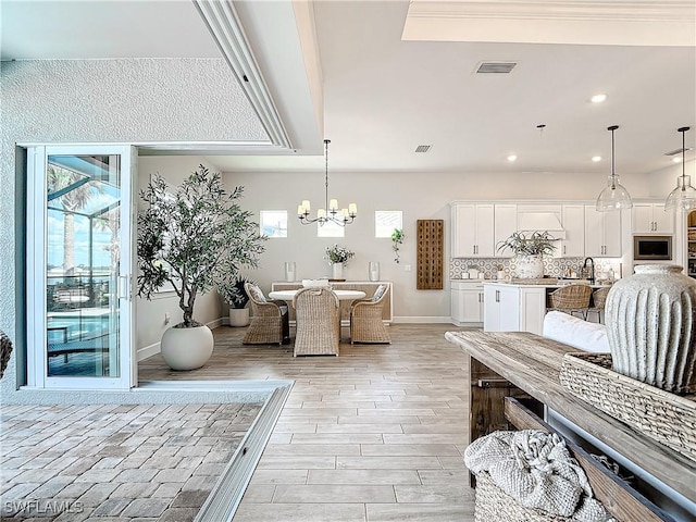 7041 Del Webb Oak Creek Blvd, North Fort Myers, FL 33917 - dining room with visible vents, baseboards, light wood-style flooring, a chandelier, and recessed lighting