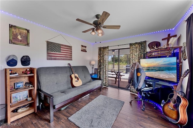 living room with ceiling fan and wood finished floors