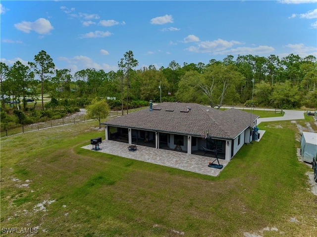 back of house featuring a patio area, a lawn, and a fenced backyard