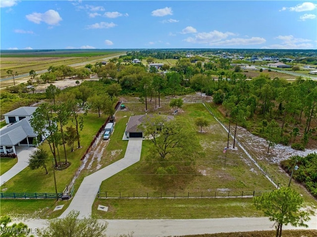 birds eye view of property featuring a rural view