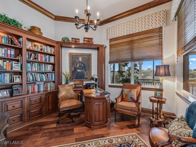 sitting room featuring a notable chandelier, wood finished floors, and crown molding