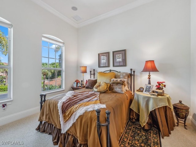 bedroom featuring baseboards, carpet floors, and crown molding