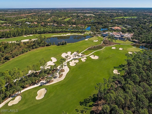 birds eye view of property featuring a water view, view of golf course, and a wooded view