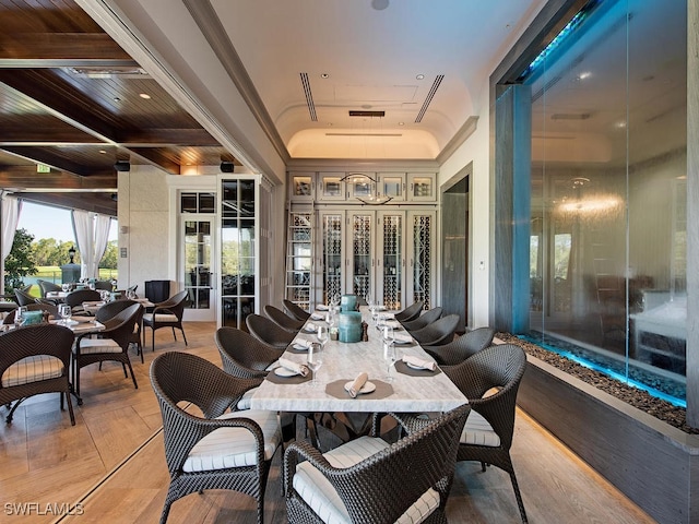 interior space with french doors and beam ceiling