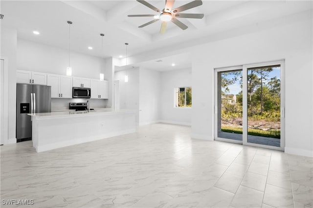 interior space with coffered ceiling, a towering ceiling, baseboards, a ceiling fan, and marble finish floor