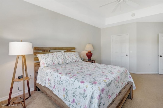 bedroom featuring light colored carpet, baseboards, and ceiling fan