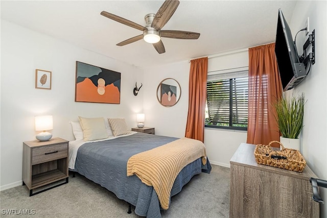 bedroom featuring carpet floors, baseboards, and ceiling fan