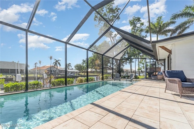 outdoor pool with a patio and glass enclosure