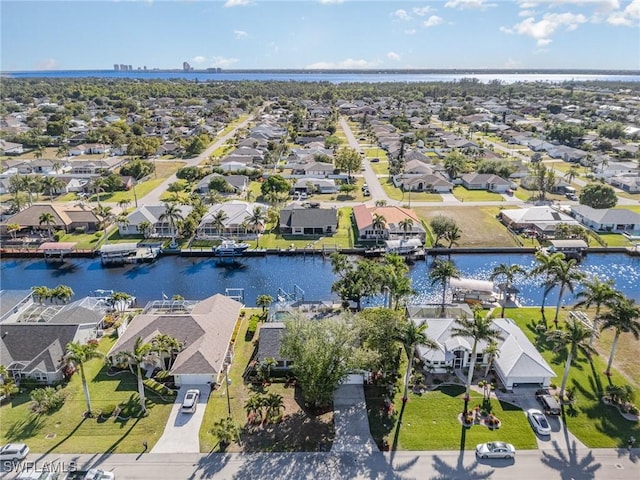 aerial perspective of suburban area featuring a nearby body of water