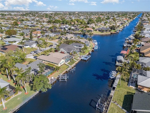 aerial overview of property's location featuring nearby suburban area and a nearby body of water