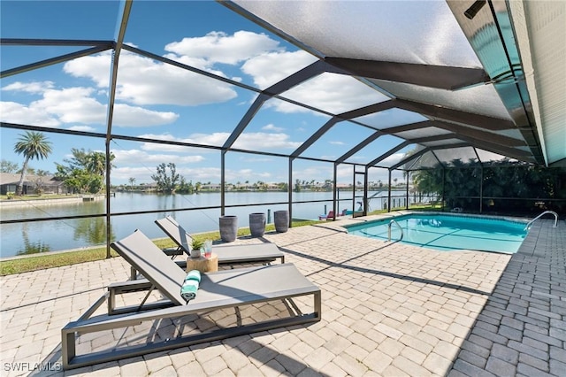 outdoor pool with a patio, a water view, and a lanai