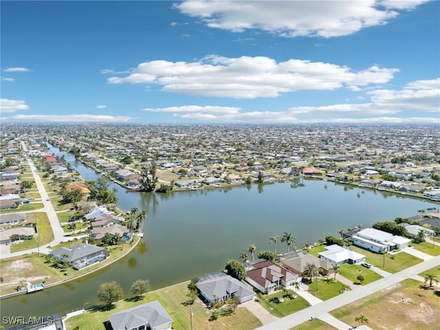 birds eye view of property with a residential view and a water view