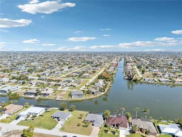 bird's eye view featuring a residential view and a water view