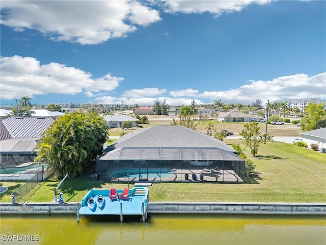 birds eye view of property with a residential view and a water view