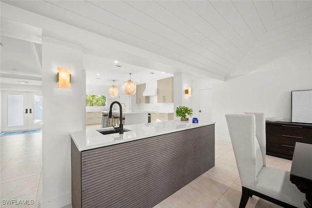 welcome area with french doors and a sink