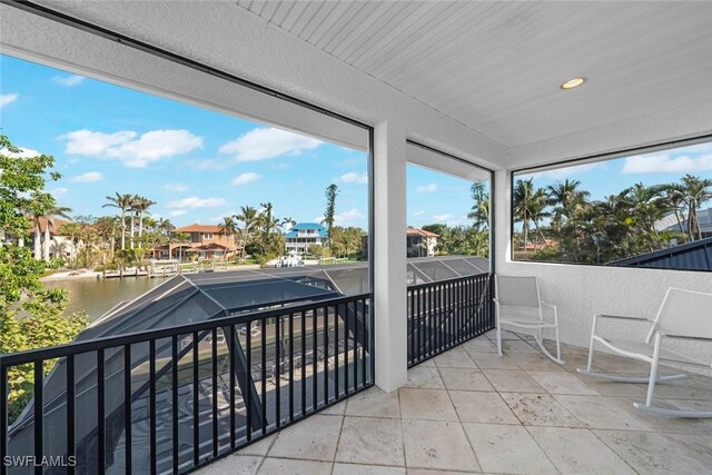 balcony featuring a water view