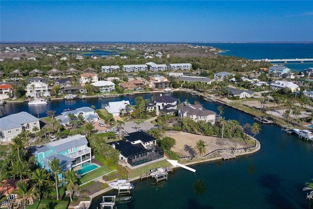 bird's eye view with a water view and a residential view