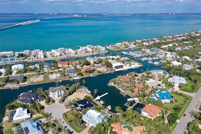 aerial view with a residential view and a water view