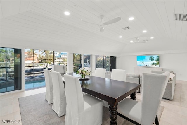 dining room featuring lofted ceiling, visible vents, recessed lighting, and light tile patterned floors