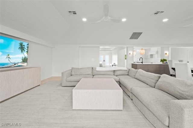 living area featuring recessed lighting, visible vents, and ceiling fan