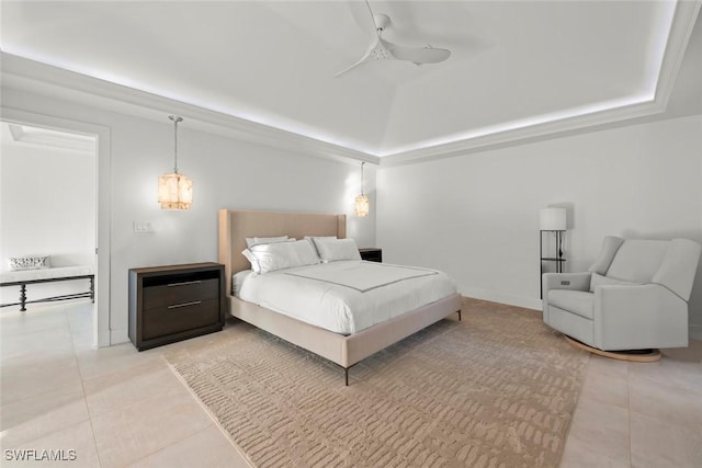 bedroom with ceiling fan, light tile patterned flooring, baseboards, vaulted ceiling, and a tray ceiling