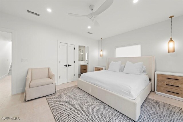 bedroom featuring recessed lighting, visible vents, connected bathroom, and light tile patterned floors