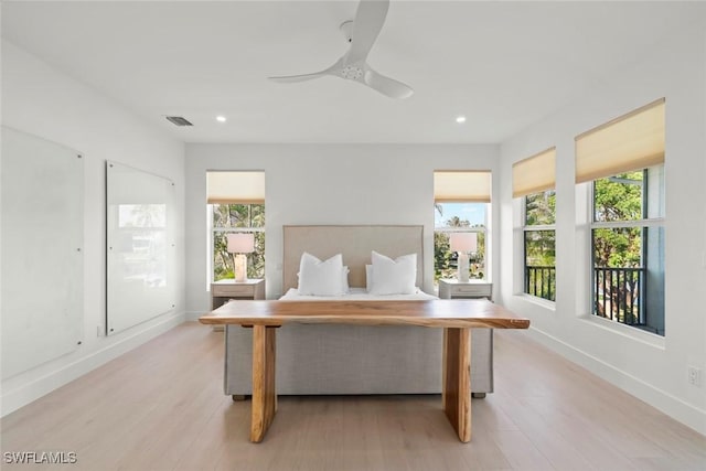 bedroom with light wood-style floors, recessed lighting, visible vents, and baseboards