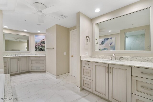 bathroom with recessed lighting, visible vents, marble finish floor, and a sink