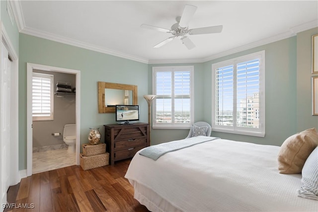 bedroom featuring multiple windows, dark wood finished floors, and ornamental molding