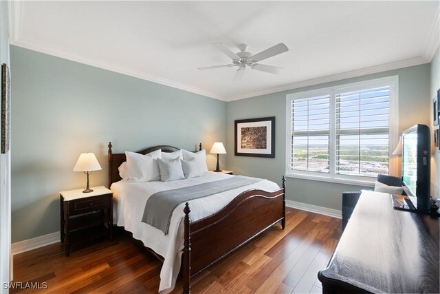 bedroom with ornamental molding, a ceiling fan, baseboards, and wood finished floors