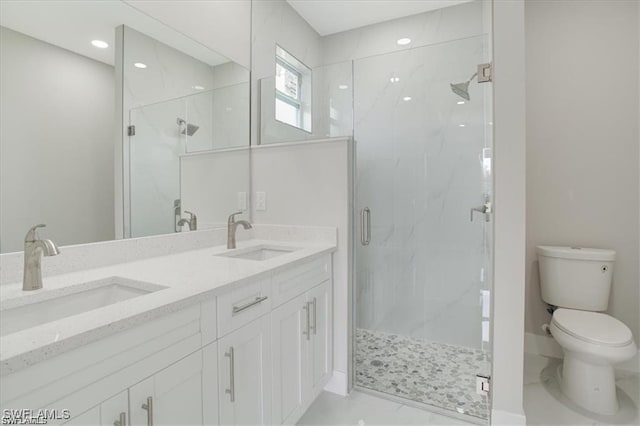 full bathroom with toilet, a sink, and a marble finish shower