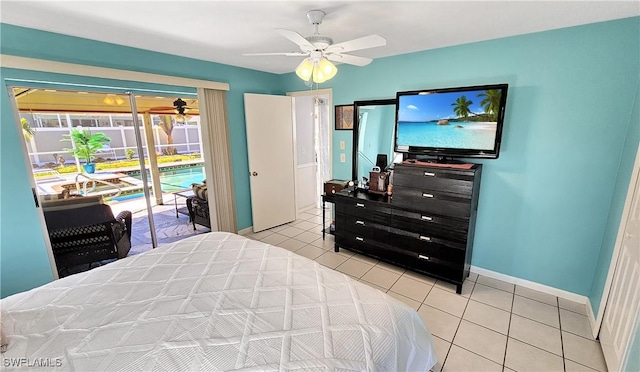 bedroom featuring access to outside, light tile patterned floors, a ceiling fan, and baseboards