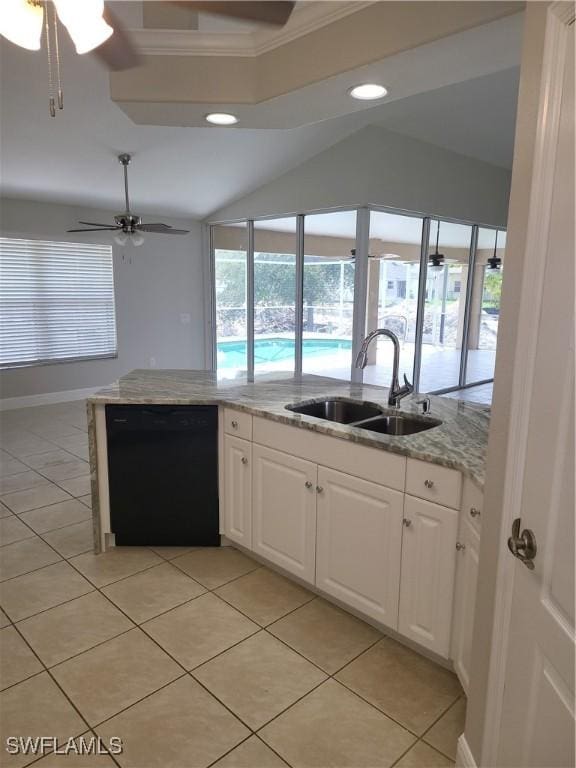 kitchen featuring light stone counters, black dishwasher, white cabinets, a sink, and ceiling fan