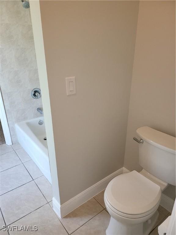 bathroom featuring baseboards, toilet, and tile patterned floors