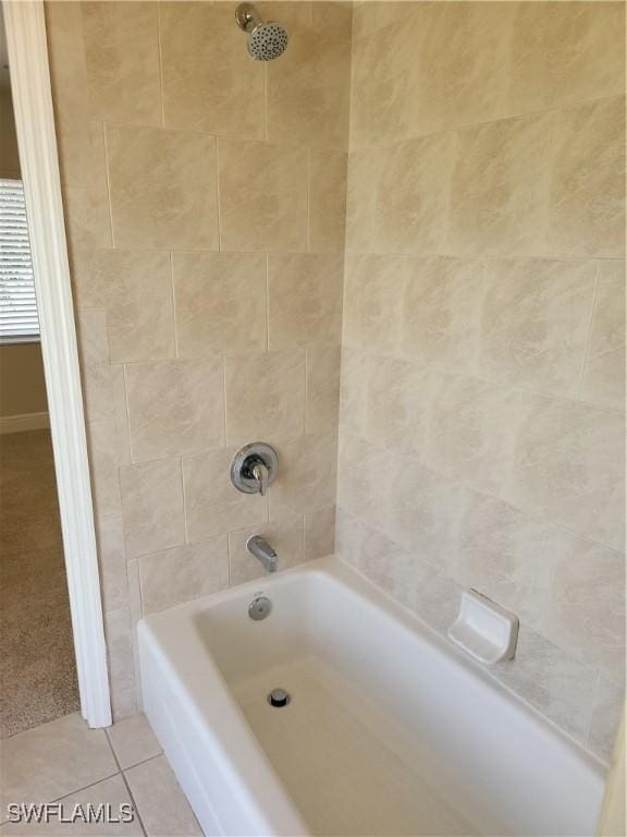 bathroom with tub / shower combination and tile patterned flooring