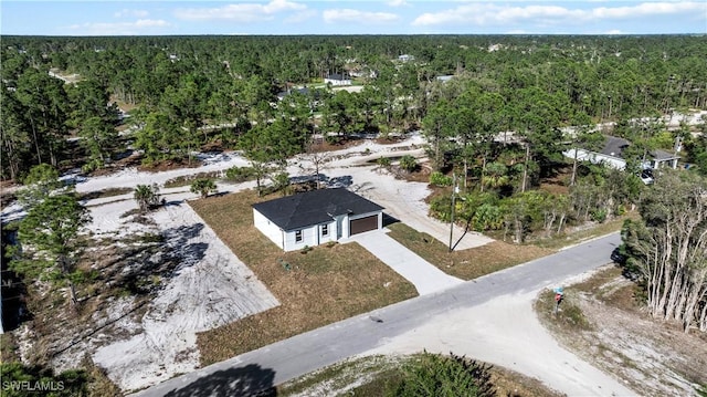 aerial view featuring a view of trees