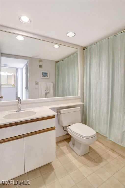 full bathroom with recessed lighting, vanity, and toilet