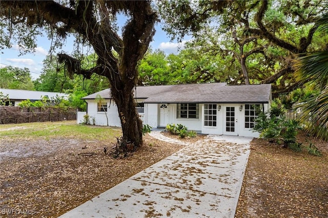 single story home with fence and stucco siding