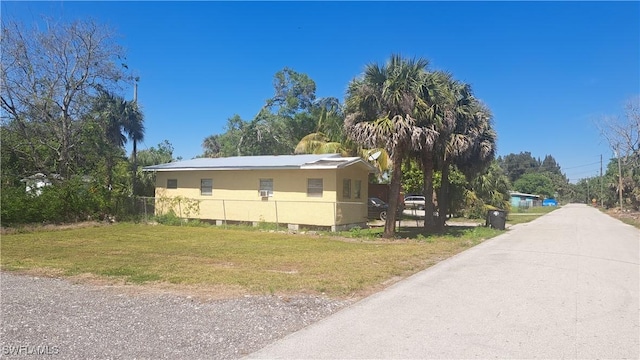 view of home's exterior featuring a yard