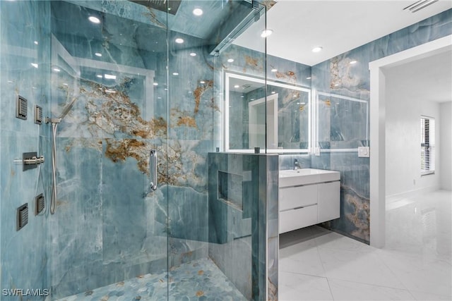 full bath featuring marble finish floor, tile walls, a marble finish shower, visible vents, and vanity