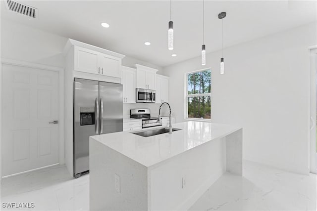 kitchen with stainless steel appliances, a sink, visible vents, white cabinets, and marble finish floor